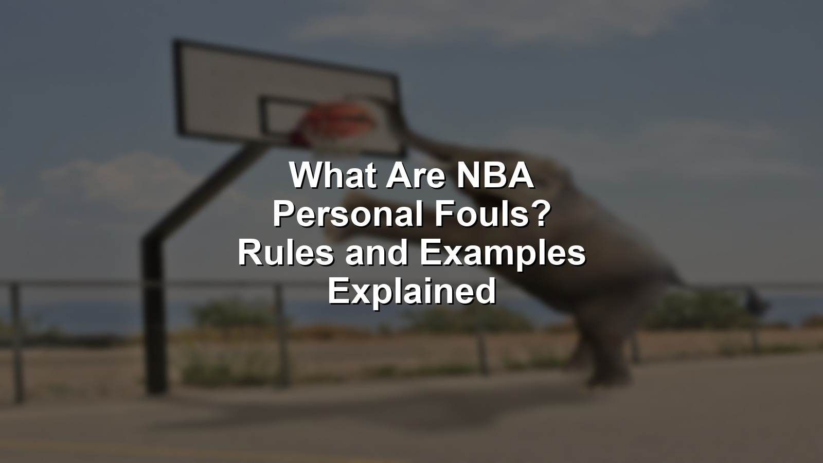 An NBA player gets whistled for a personal foul attempting to stop a layup, illustrating what are NBA personal fouls.